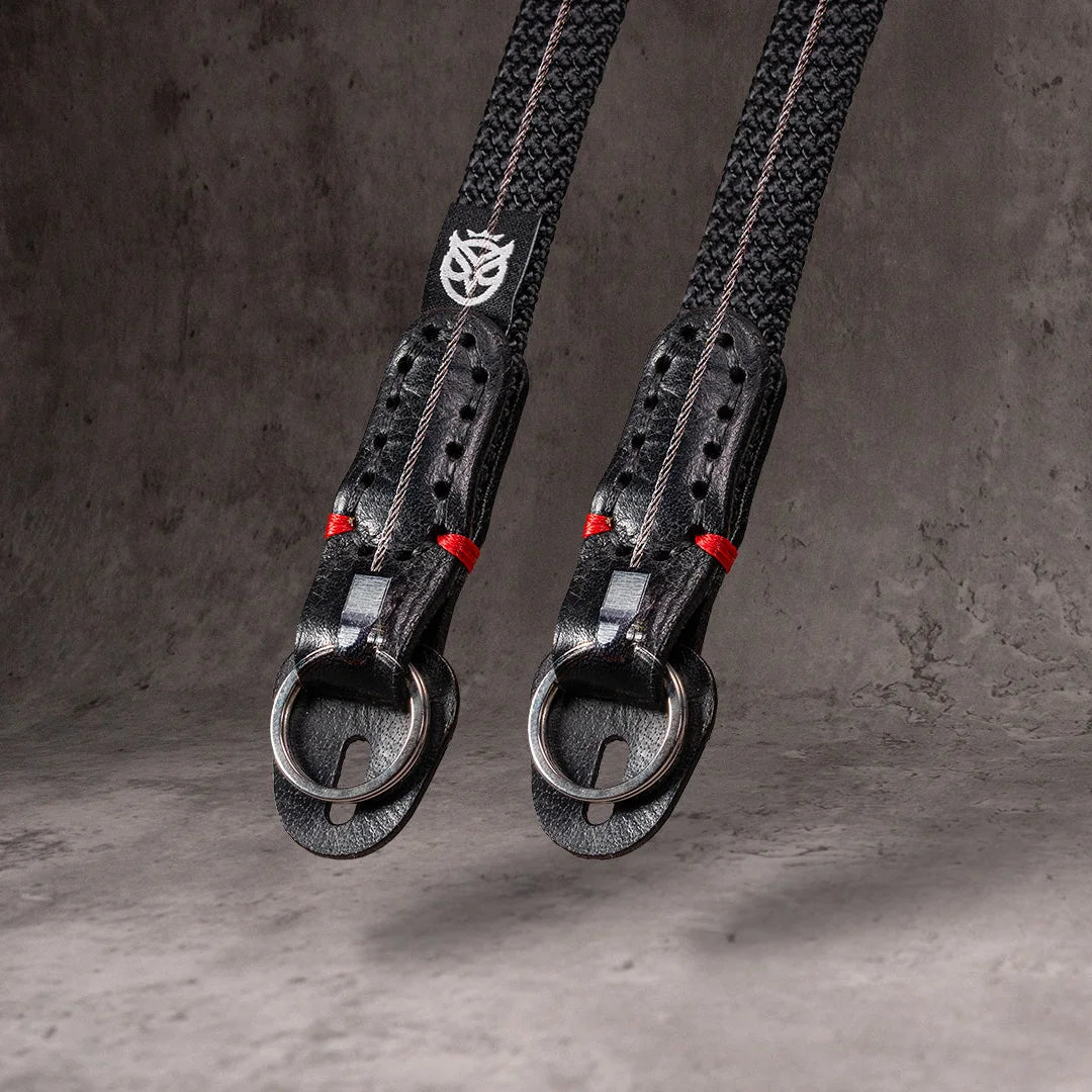 Two No Slice Steel Core straps hanging, the steel cable visible running through each