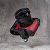 OxBlood FlexCase mounted on a tripod clamp by its concealed Arca profile