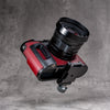OxBlood FlexCase on a tripod clamp, showing the camera stays in the case