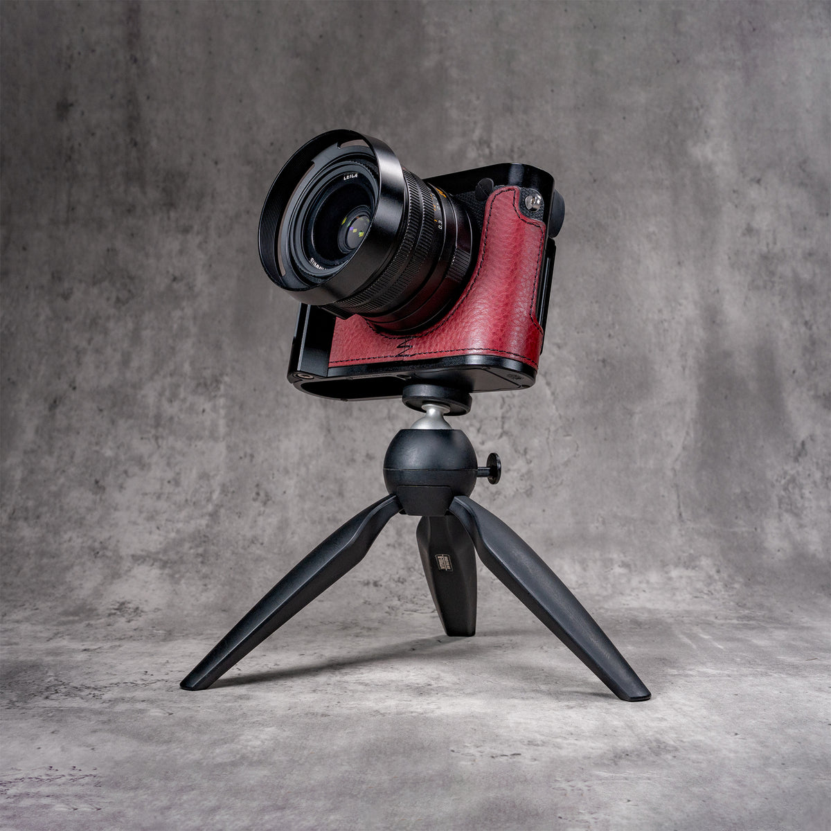 Leica Q in the OxBlood FlexCase on a tabletop tripod