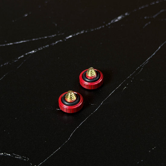 Two Red Cerakote Shutter Toppers from below, showing the brass thread and inlaid o-ring